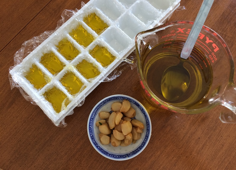 ice cube tray with garlic olive oil